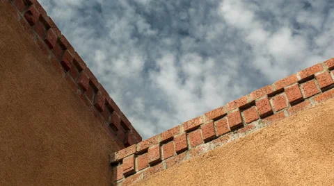 Detail of an adobe roofline with brick Stock Footage 60731997