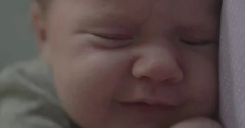 Detail of baby face waking up from nap Stock Footage