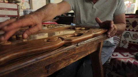Detail of a backgammon game. Handmade old wooden backgammon. Stock Footage 123526041