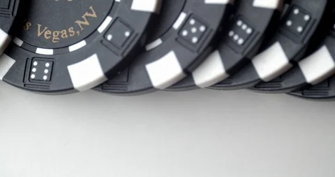 Detail of base of  $100 chips dashed across table Stock Footage 112332012