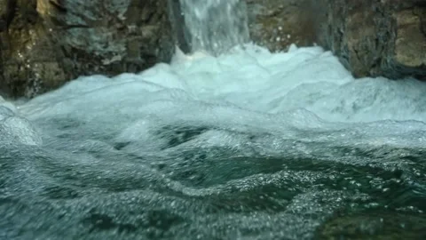 Detail of a beautiful waterfall in between rocks in the mountains Stock-Footage 211498249