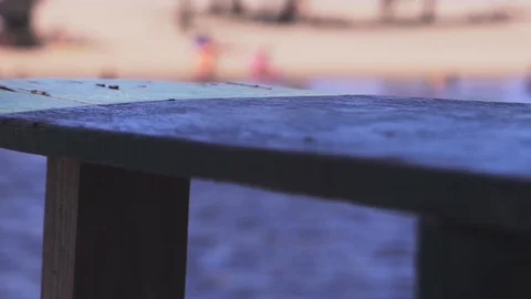 Detail of a bench on the beach 動画素材 128094734