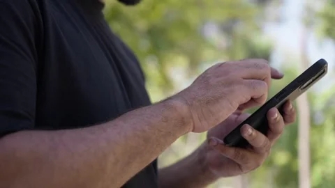 Detail of black man hands using smartphone mobile phone Stock Footage 287491837