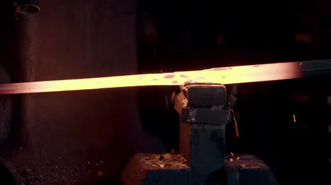 Detail of blacksmith using industrial hammer to shape hot metal 4K Stock Footage 49371826