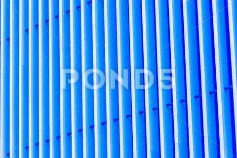 Detail of blue striped metal facade for background Stock Photos