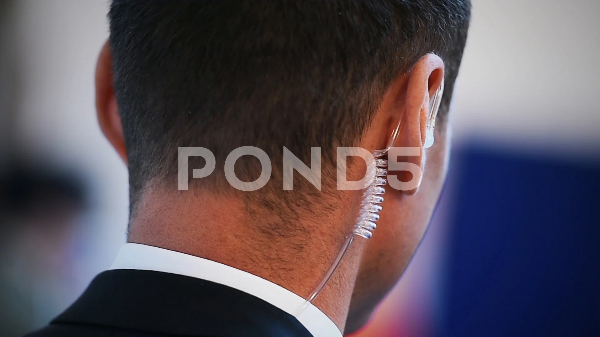 Detail with a bodyguard wearing in ear Stock Video Pond5