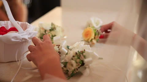 Detail of bride taking one small flower Stock Footage 46709118