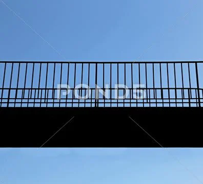 Detail of bridge suspended above the void to cross the valley Stock Photos