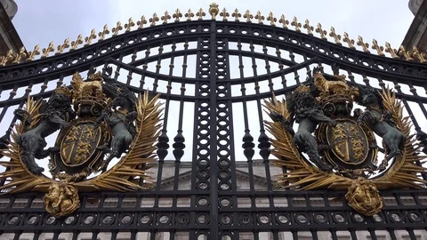 Detail of Buckingham Palace Gates, London, UK tilt, grey sky Stock Footage