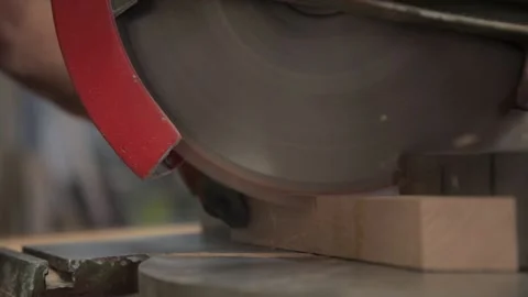 Detail of a carpenter using a wood circular electric saw. Wood cutting machin Stock Footage 168544970
