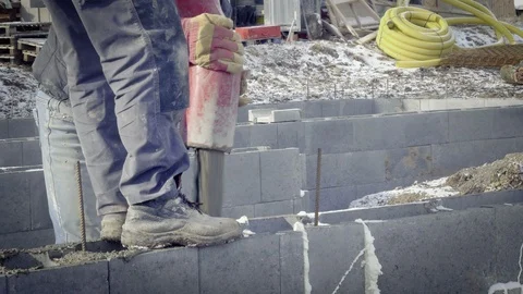 Detail of casting pump concrete to foundations. Workers work on site. Видео 87534506