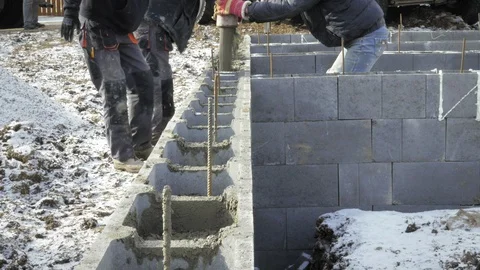 Detail of casting pump concrete to foundations. Workers work on site. Vídeos de archivo 89781796