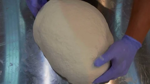 Detail of Chef hands in process of preparing a pizza Stock Footage 82594556