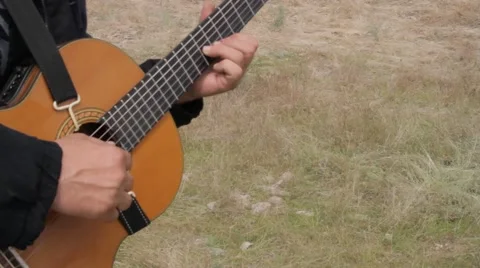 Detail of a classical guitar player Stock Footage 63244220