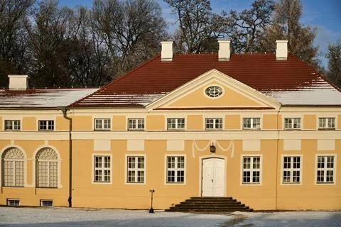 Detail of the Classicist facade of the palace in Rogalin during winter Stock Photos