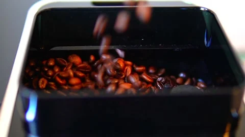 A detail of a coffee machine shows a container filled to the brim with fresh Stock Footage 299077922