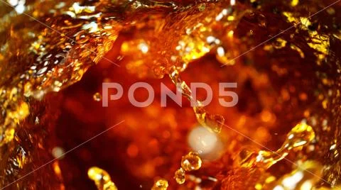 Detail of cola, tea or hard spirit beverages whirl Stock Photos