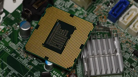 Detail of Computer CPU Chip and CPU socket over PC Motherboard. Stockbeeldmateriaal 127586142
