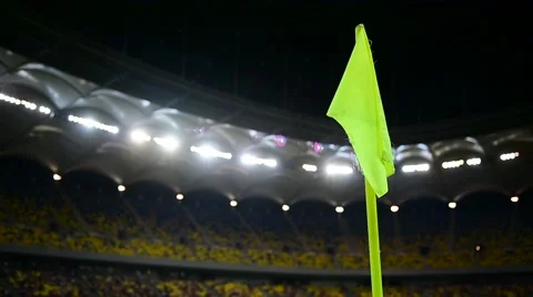 Detail with corner flag post blown by wind on soccer stadium at night 스톡 동영상 65782295