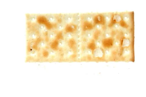 Detail of a cracker isolated on white background Stock Photos