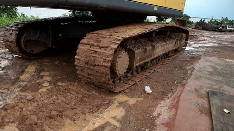 Detail of a crawler advancing in the mud Stock Footage 70282226