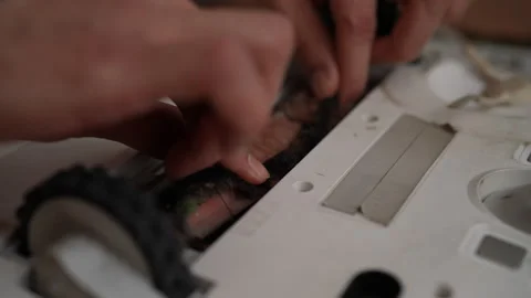 Detail cropped shot of technician pulling dirty brush out of compartment of Stock Footage 304863461