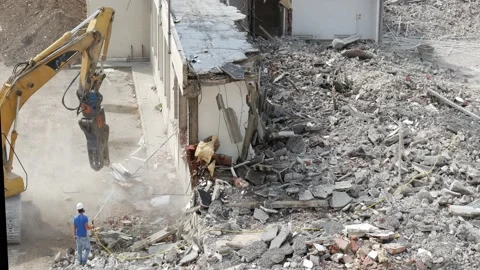 Detail of a demolition grapple at work on a construction site    2 Video stock 197044636