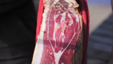 Detail of dried spanish ham while being sliced. 스톡 동영상 152245557