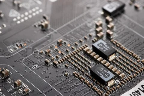Detail of electronic components and microchips on a video card. Latest genera Stock Photos