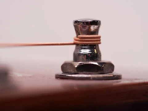 Detail of a fastened guitar string Stock Photos