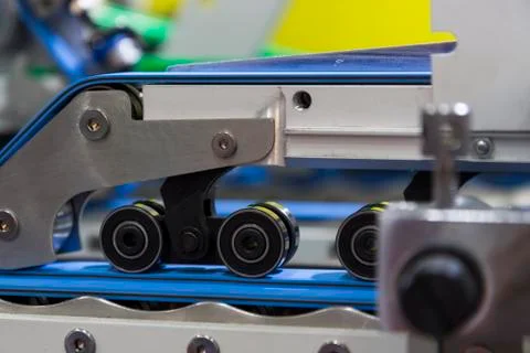 Detail of a folder gluer machine Stock Photos