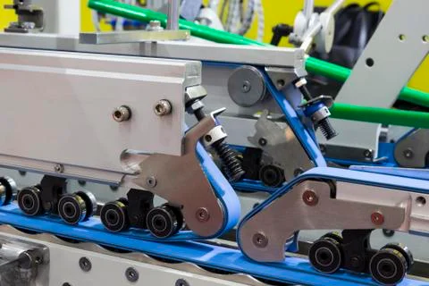 Detail of a folder gluer machine Stock Photos