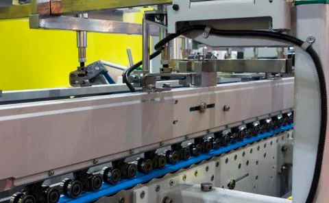 Detail of a folder gluer machine Stock Photos