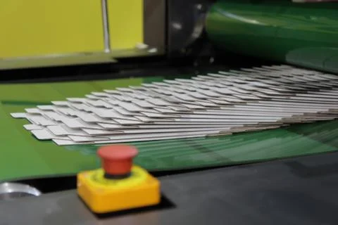 Detail of a folder gluer machine Stock Photos