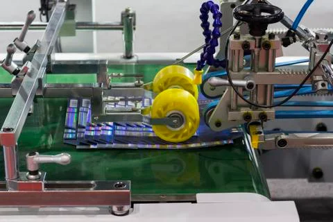 Detail of a folder gluer machine Stock Photos