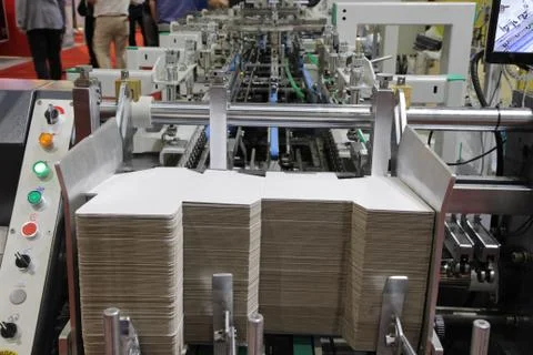 Detail of a folder gluer machine Stock Photos