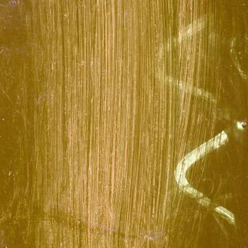 Detail of gold iron surface with white lines. Stock Photos