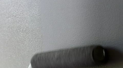 Detail of gray paint rolling on to half wet wall 4K Stock Footage 49274036