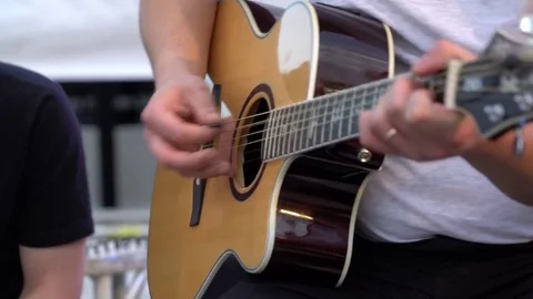Detail of a guitar player Stock Footage 76355467