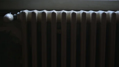 Detail with a hand checking the heat coming from a household radiator 스톡 동영상 101306276