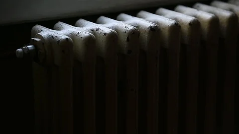 Detail with a hand checking the heat coming from a household radiator Video stock 101306288