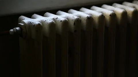 Detail with a hand checking the heat coming from a household radiator Video stock 101307776