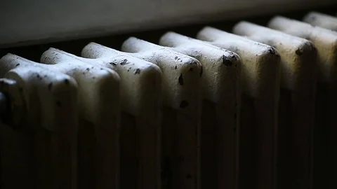 Detail with a hand checking the heat coming from a household radiator Video stock 101307784