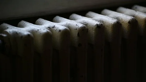 Detail with a hand checking the heat coming from a household radiator Video stock 101307845