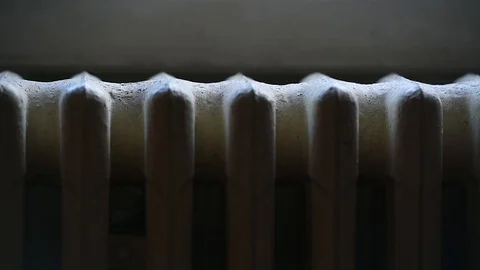 Detail with a hand checking the heat coming from a household radiator Video stock 101307933