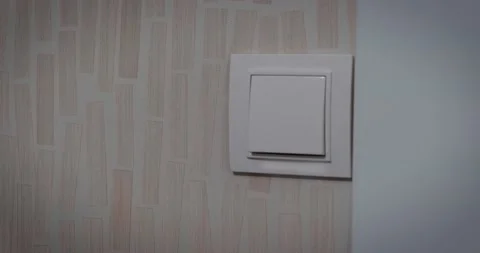 Detail of a hand closing the light switch Stock Footage 232318813