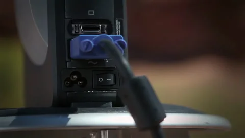 Detail of Hand Inserting Video Cable into Projector, Setup for Outdoor Event 4K Stock Footage 332243553