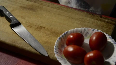 Detail of hands cutting a tomato. Stock Footage 135605085