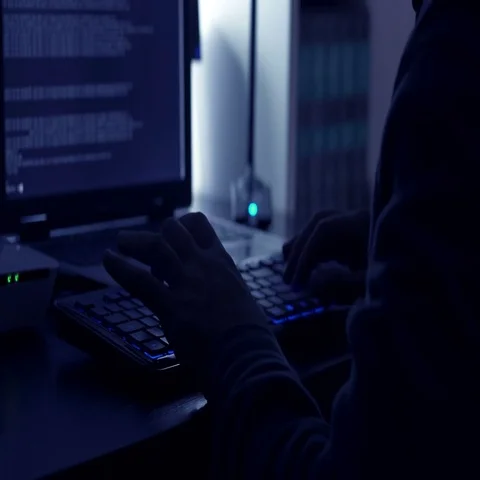 Detail of the hands of hackers in the dark typing on computer Stock Footage 69510568