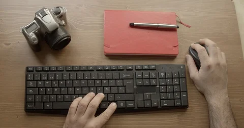 Detail of hands typing a computer on an office table Stock Footage 129555931